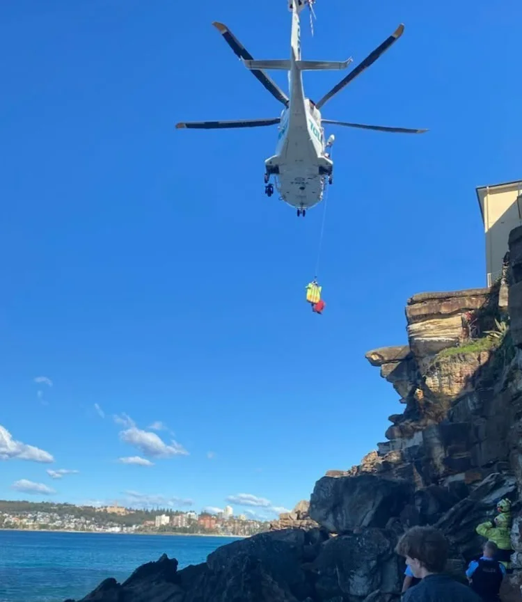 Emergency crews working beside coastal rock platform